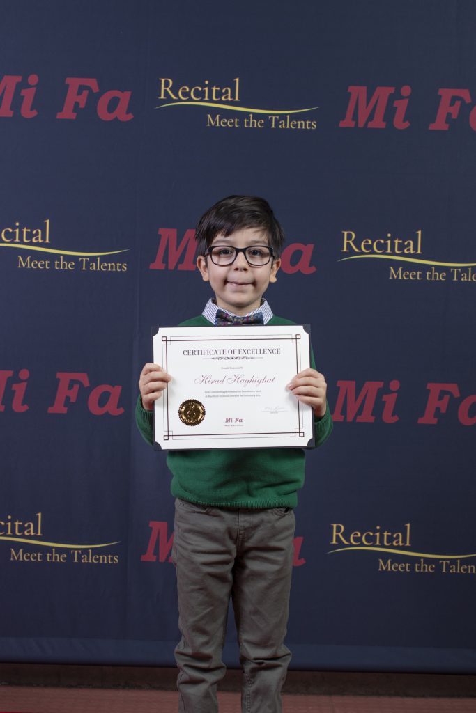 kids standing with certificate